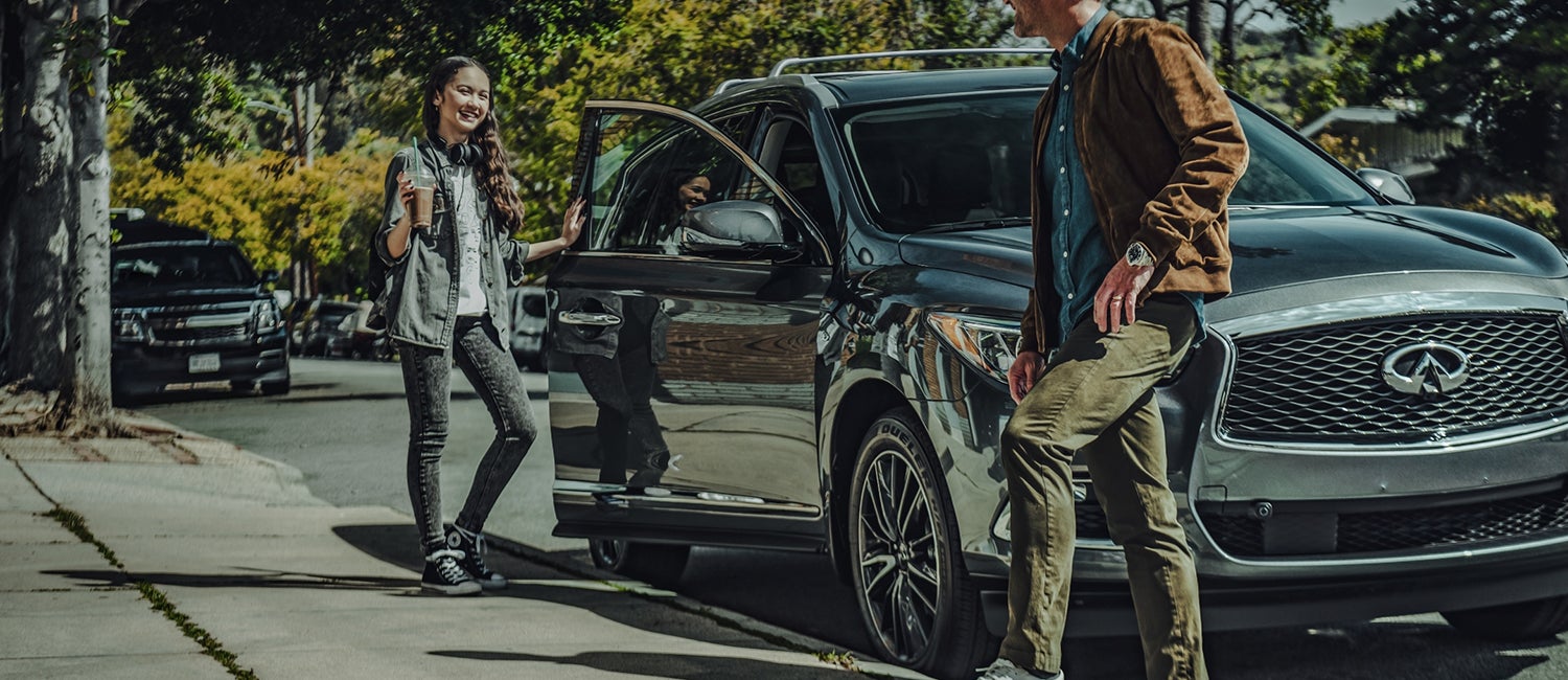 Young woman getting into an INFINITI