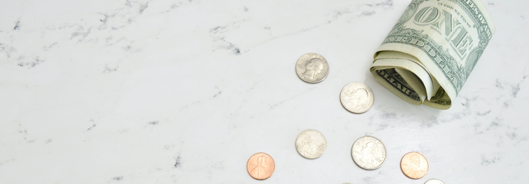 dollar bills and change on counter